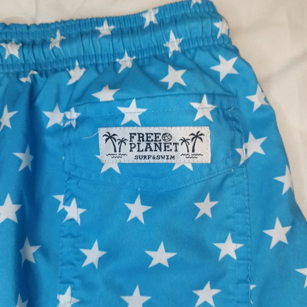 Free Planet Swim Trunks. Men's 3xl. Stars And‎ Rainbow Stripes.